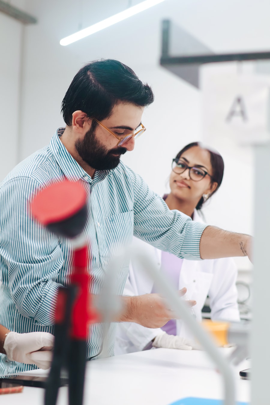 Two researchers working side by side at a laboratory bench