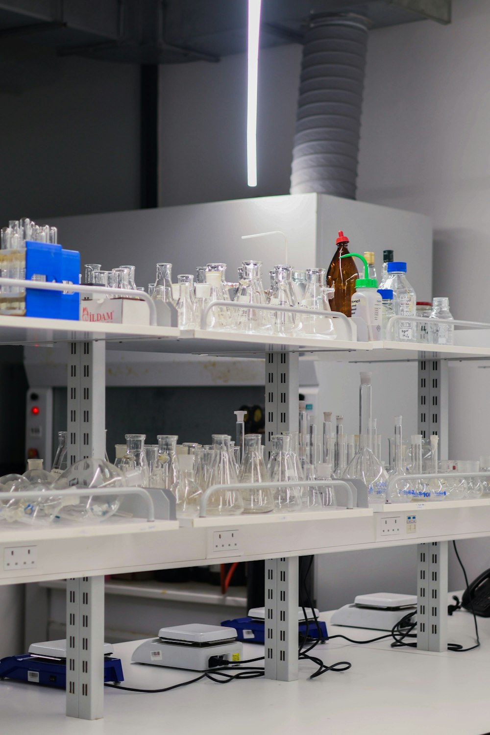 Glassware and equipment on the shelves of a university research laboratory